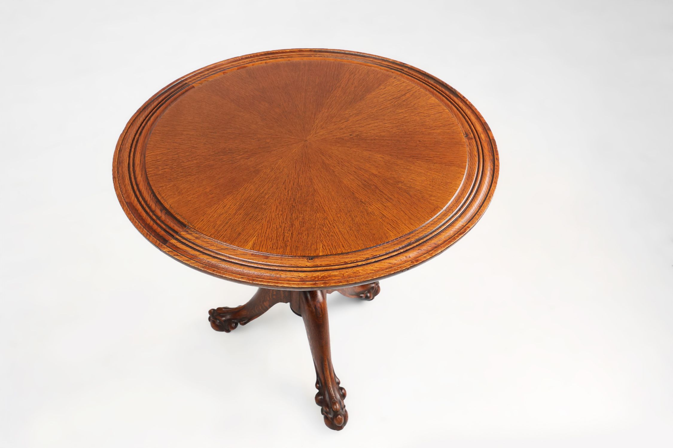 Antique English hand carved circular oak side table with lions head feet thumbnail